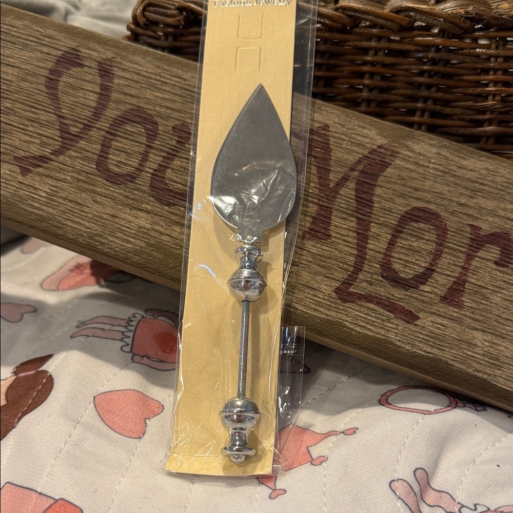 Cake knife envelope opener wine stopper cheese cutter